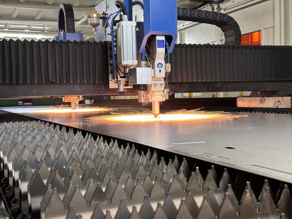 Industrial fiber laser cutting machine processing steel sheet in the Jinan factory
